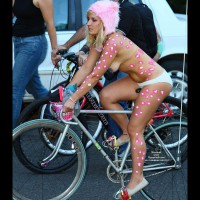 Topless Girl Riding Bike - Topless , Body Paint, Nose Piercing, White Panties, Showing Face, Riding Bike, Topless Girl On Bike, Pedalling Bicycle, Pink Leopard Spots, Hanging Breast, Event Voyeur