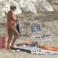 Pic #1 Old Woman Changing On The Beach