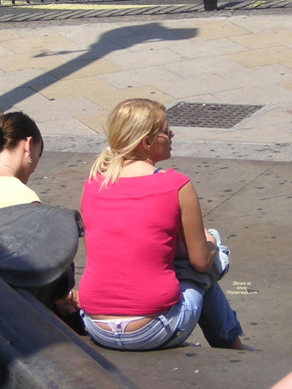 London Ladies Upskirt/thong Volume 7 , Lovely Little Pink Lady In London. I Love The Thong, And Her Friend Is Even Trying To Get In On The Photo With Her Bum Clevage