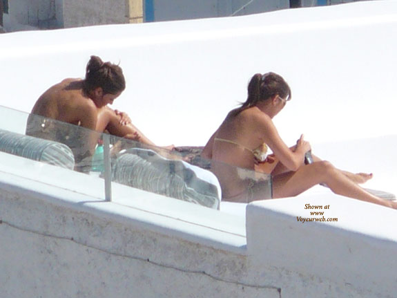 Topless On The Terrace 01 , After Many Years As A &quot;devote&quot; User, I Finally Have The Chance To Send Some Contris.... Surely Not The Best Quality, Since I Am A Bit Shy And Tend To Rely To Much On The Digital Zoom. <br />These Series Were Shot A Few Days Ago In Ponza, Small Island Not Far Away From Rome. One Lucky Morning I Got Up And Went Out On My Room&#39;s Balcony And This Is What I Saw: Two Young Women Getting Some Morning Suntan Topless, Taking Pictures, Listening To Some (orrible) Music And Even Dancing.... That Was My First Chance To Shoot Some Pictures For VW. Hope You Will Enjoy It.