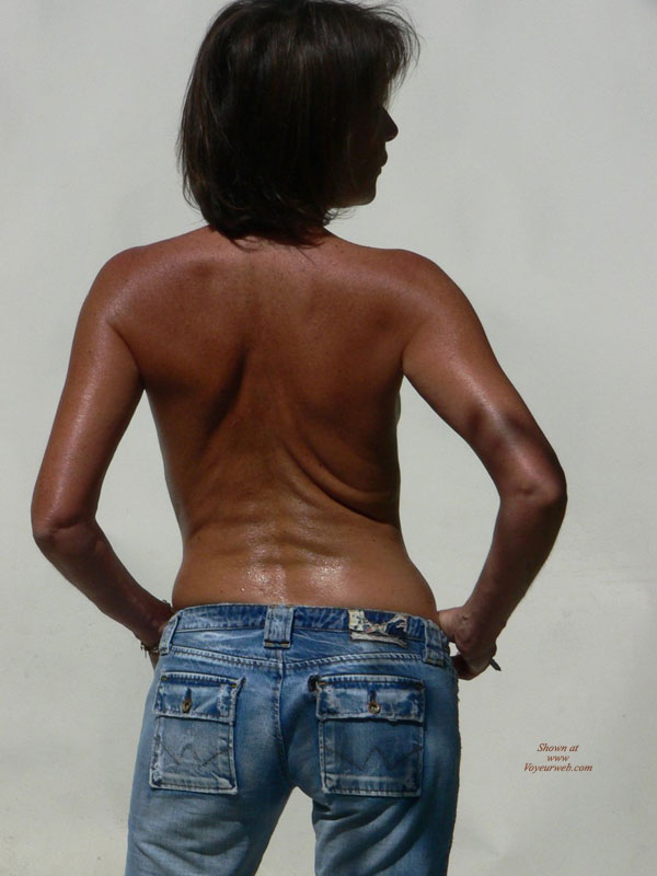 Rearview Of A Topless Black Girl - Topless , Blue Jeans, Topless In Blue Jeans