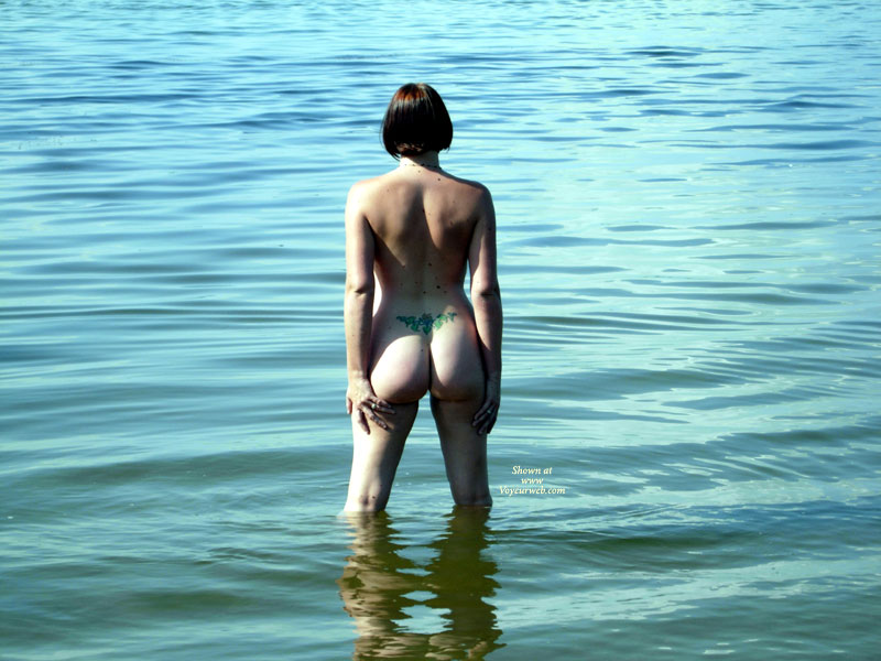 Naked Girl From Behind In Water - Brunette Hair, Tan Lines, Naked Girl, Nude Amateur , Skinny Dipping, Outdoor Brunette In Knee Deep Water Rear Shot Standing, Narrow Waist, Reflection Of A Fine Ass, Soft Reflections, Woman In Lake, Tattooed Backside In Lake, Knee Deep Wading Naked, Lower Back Tattoo, Nude From Behind Standing In Lake, Brunette Short Hair